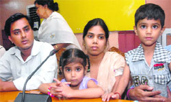 Widow of Vijay Kumar, along with her children and other family members, addresses mediapersons in Jalandhar on Wednesday. Tribune Photo: Malkiat Singh