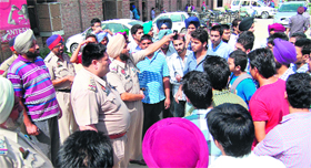 Police officials talk to agitating students  in Amritsar on Thursday.