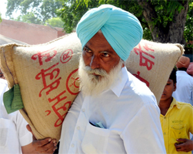 a farmer carries home a bag of seeds he purchased at the fair.