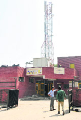 A mobile phone service tower on the rooftop of the community centre at Sector 28, Chandigarh. 