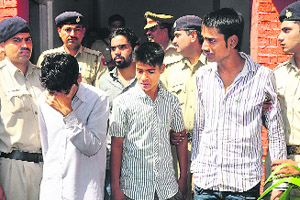 The accused at the Sector 26 police station in Chandigarh on Thursday. 