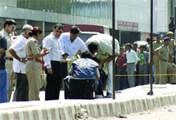 The bomb disposal squad checks the bag in front of New Delhi Railway Station on Thursday. Tribune photo: Manas Ranjan Bhui
