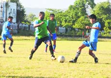 Players in action during the Lala Nemi Dass Memorial Football League in Dehradun on Thursday.