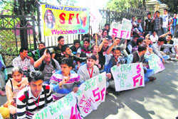 SFI activists raise slogans at the DC office complex in Shimla on Thursday. Photo: Amit Kanwar