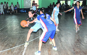 Players in action during the Inter-Collegiate Basketball Championship at University of Jammu on Thursday. 
