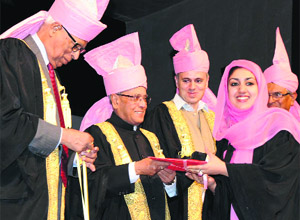President Pranab Mukherjee presents the Best Graduate of the Year 2009 to Yenbuerzal, a student of Department of History, Kashmir University, in Srinagar on Thursday. 