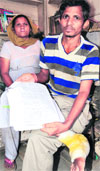Hem Raj shows his name in the list of the CMs cancer relief fund in Amritsar. Photo: Vishal Kumar