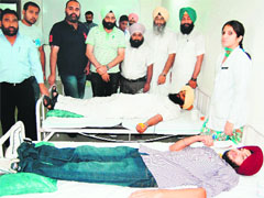 Volunteers donate blood at a camp organised to commemorate the birth anniversary of Shaheed Bhagat Singh by the PPP in Amritsar on Friday: Photo: Sameer Sehgal
