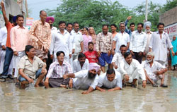 A file photo of the protest by residents of Lal Singh Basti against the inadequate sewerage facility in the area.