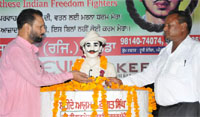 Residents pay floral tributes at the statue of Shaheed Bhagat Singh in Bathinda on Friday. A Tribune photograph