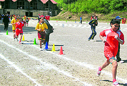 A 800 m race in progress during the first day of the athletics meet in Mussoorie on Friday