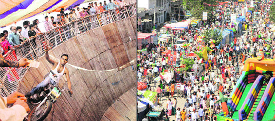 A man performs stunts on his bike in the maut ka kuan at the Sodal Mela; and (right) devotees at the mela in Jalandhar on Friday. 