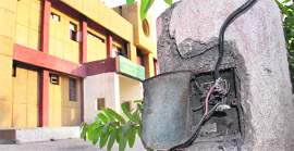 Naked wires hang from a streetlight pole outside the trauma ward in the Civil Hospital in Jalandhar. 