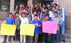 Members of the All Kargil Buddhist Student Association protest outside the Ladakh House in Jammu on Friday. 