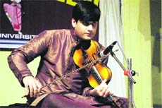 A participant performs at the instrumental percussion competition at University of Jammu on Friday.