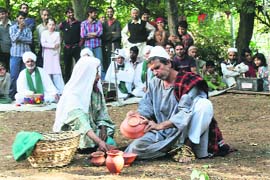 Artistes enacts a scene from the play Shikar Gah in Aishmuqam on Friday.