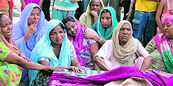 Members of the deceaseds family wail