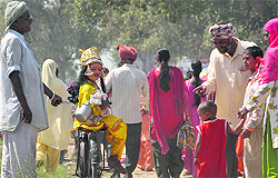 A child dressed as Lord Krishna.