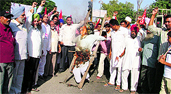 CITU members burn an effigy of the state government in Ludhiana on Friday