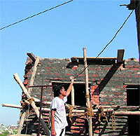 High-tension lines passing over his house