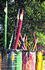 Artists give finishing touches to the graffiti near the Sukhna Lake. 