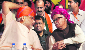 BJP leaders Narendra Modi and LK Advani at a rally in Faridabad on Friday. 
