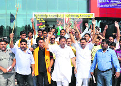 Activists hold a protest against the newly-released movie "Oh My God" outside a theatre in Patiala, on Saturday. Tribune photo: Rajesh Sachar