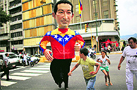 A person dressed as Venezuelas President Hugo Chavez crosses a road in downtown Caracas. The countrys presidential elections are scheduled for October 7