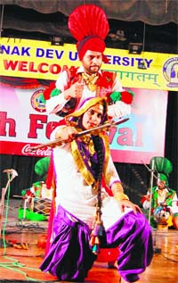 Students play folk instruments during the Youth Festival at the GNDU in Amritsar on Saturday.
