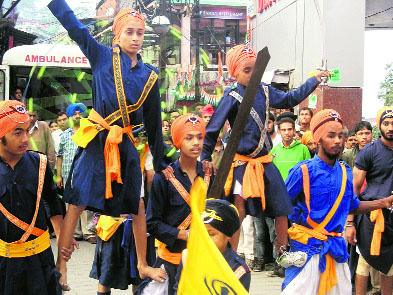 Members of the Sikh community perform gatka in Mussoorie on Saturday.