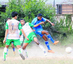 A match in progress in the Dehradun District football league at Rangers College ground in Dehradun on Saturday.