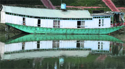 A view of houseboat in the Jhelum river in Srinagar on Saturday. Tribune photo: Amin War