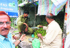 A vendor selling apples in a Rajouri market. Tribune photo