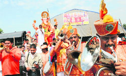 Devotees carry the idol of Lord Ganesha for immersion ceremony in Jammu. A Tribune photograph