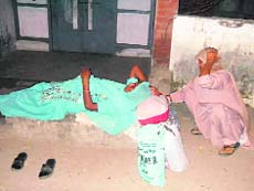 A pregnant woman lies in the open at the Khanna Civil Hospital on Friday.