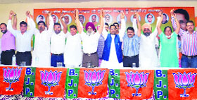 Cabinet minister Anil Joshi along with BJP senior leaders and councillors during a meeting of party workers in Amritsar on Sunday.