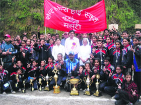 The chief guest with the overall champions in the 12th Regional Athletics Meet in Mussoorie on Sunday.
