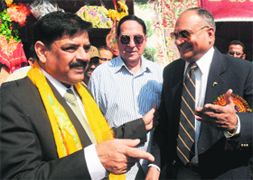DGP Ashok Prasad talks to ADGP K Rajendra at the inauguration of 21st Police Public Mela in Srinagar on Sunday. 