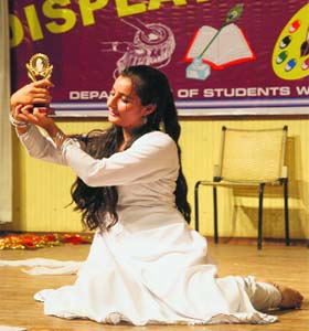 A student performs during the display your talent competition in Jammu on Sunday