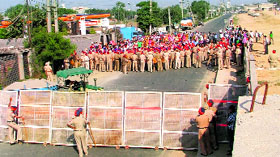 Police personnel deployed on the GT Road following a protest by members of the Sikhya Provider Union, Punjab, and Un-aided Staff Aided Schools Front, Punjab, in Ludhiana on Sunday.