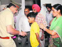 A police official interacts with the family of a complainant, Om Prakash (second from left), at the UT Secretariat in Chandigarh on Monday. 