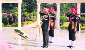 Lt Gen Manvender Singh, Commandant, Indian Military Academy, salutes after laying wreaths at the martyrs memorial on the 80th raising day of the academy in Dehradun on Monday