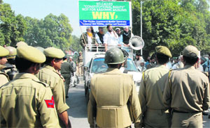 Policemen stop members of Jamiat Ahlihadees, a Muslim religious group, during a demons- tration in Srinagar on Monday.