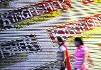 Women walk past a closed booking office of Kingfisher Airlines in New Delhi. Labour unrest forced Kingfisher to cancel all its flights on Monday in the latest blow for the ailing carrier as it scrambles to find an investor, sending its stock down by its maximum daily limit.  Reuters 