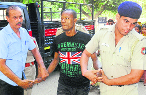 The accused, Daniel Ebera, being taken to the GMSH-16 for a medical examination on Tuesday. 