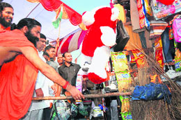 Yoga guru Ramdev burns products of foreign multinational companies in Haridwar on Tuesday.