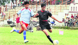 A match in action during the Lala Nemi Dass Memorial Football Tournament in Dehradun on Tuesday.