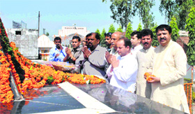 Activists of the Uttarakhand Kranti Dal (P) pay tributes to martyrs of the statehood movement at Shaheed Smarak at Rampur in Muzzaffarnagar on Tuesday.