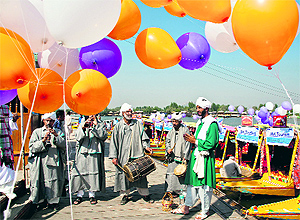 Folk musicians perform at the Shikara Festival organised by the J&K Tourism Department at Srinagars Dal Lake on Tuesday to promote tourism in Kashmir. Tour operators from 32 countries are participating in the festival