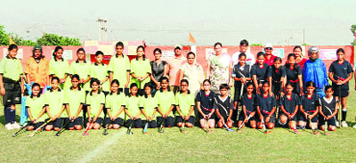 Winners of the North Zone CBSE Schools Hockey Tournament with the players of Tarn Taran in Ludhiana on Tuesday. 